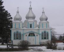 View of east elevation of Holy Trinity Ukrainian Greek Orthodox Church, east elevation featuring the entryway and spires, 2005.; Government of Saskatchewan, Michael Thome, 2005.