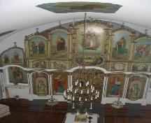View of interior of church featuring the iconostasis which is richly decorated with Ukrainian Orthodox iconography, 2005.; Government of Saskatchewan, Michael Thome, 2005.