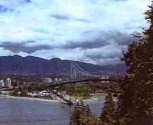 View of the Lions Gate Bridge, showing one of its twin, tapered open work towers that consist of sections of flat and angled steel, 2003.; Parks Canada Agency / Agence Parcs Canada, Judith Dufresne, 2003.