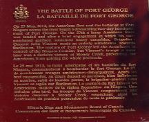 Battlefield of Fort George National Historic Site, showing the plaque text marking the north east corner of the battle site, 1989.; Parks Canada Agency/Agence Parcs Canada 1989
