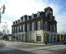 Northeast facade showing fire station doors, rounded arch windows and dormers; D. Menard
City of London