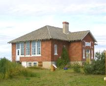 View southwest at northeast and southeast elevations, 2004.; Government of Saskatchewan, Marvin Thomas, 2004.