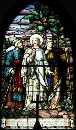 Stained-glass window behind the altar.