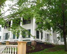 View of the façade and Main Street side of the Honourable Charles Connell House.; Carleton County Historical Society