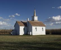 View of the north and west facades showing the original 1910 structure with the addition which was made in 1918 (September 2003) ; Alberta Culture and Community Spirit, Historic Resources Management Branch, 2003