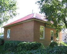 Front and side elevations, showing hip roof and signage.; Government of Saskatchewan, J. Bisson, 2004