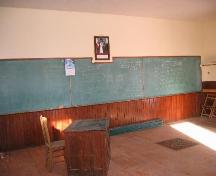 Interior of School looking at the blackboard of Pinto River School.; Clint Robertson, 2006.