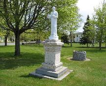 The monument adorned with a plaque that briefly describes the life and work of Father Lafrance.; Town of Tracadie-Sheila