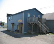 Rear of the building, entrances for two other businesses and the second floor appartment.; Town of Tracadie-Sheila