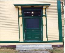 View of main entrance showing decorative shelf, brackets and detailed moulding, O'Reilly House, Placentia.; HFNL/ 2006