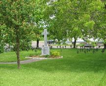 View of the Religious Hospitallers of St. Joseph Cemetery with the cross inscribed with their eulogy; Town of Tracadie-Sheila
