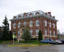 Front and side elevations, showing dormer windows, symmetrical layout, and windows.; Government of Saskatchewan, J. Bisson, 2003