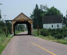 Former Gayton School - Distant view taken from the northwest showing the location of the school near the Gayton covered bridge that spans the Memramcook River.; Gérard LeBlanc
