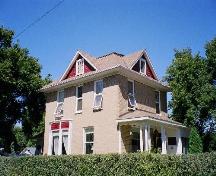 View of South and east sides of Brinkworth Residence viewing the front porch and massing, 2006; Ross Herrington, 2006.