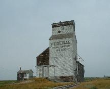 Elevator still on original site next to railway tracks, 2004.; Government of Saskatchewan, Lisa Dale-Burnett, 2004.