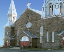 North side of Saint-Jean-Baptiste Church showing main entrance and rose window.; Restigouche Regional Museum, Dalhousie