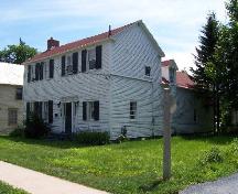 This image presents the dormer window on the side of the structure and the walking trail beside the house.; City of Fredericton 2004