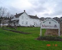 View of Traveller's Hotel looking east from Murray's Corners, February 2004.; Township of Langley, Julie MacDonald, 2004.
