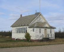 View showing pedimented entryway and west-facing window wall, 2004.; Government of Saskatchewan, J. Bisson, 2004