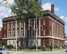The 3-storey Neo-Classical Revival style red brick Masonic Temple features fluted stone pilasters.; City of Windsor, Nancy Morand