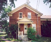 View of the north elevation of the main house showing the secondary entrance – August 2003; OHT, 2003