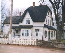Showing hipped gable roof, verandahs, and shingle styles; West Prince Acadian History Committee