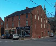 Showing window placement, brickwork, quoins, and raised parapet gable ends; City of Charlottetown, John Boylan, 2004
