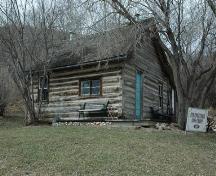 View of the Eckenfelder Log Cabin at the St. Anne Ranch Provincial Historic Resource site, Trochu looking northwest (April 2006); Alberta Culture and Community Spirit, Historic Resources Management, 2006