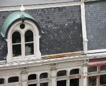 Detail showing fourth level dormer window, inset into mansard slate roof.; OHT, 2004