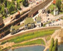 Contextual aerial view of complex showing location of rail tracks and shoreline - c.1960; OHT, c.1960