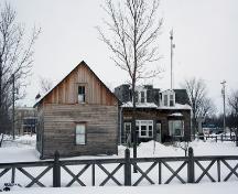 Contextual view, from the northwest, of the McDougall House (with another designated City of Winnipeg site, Pembina Highway House, in the background), Winnipeg, 2007; Historic Resources Branch, Manitoba Culture, Heritage and Tourism, 2007