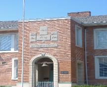 Date and name stones on the tower of Robertson Public School above the bell.; Photograph by Callie Hemsworth, 2007.
