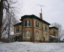 Featured are the shallow-arched first-storey and deep-arched second-storey windows.; County of Brant, Community and Development Services, 2007.