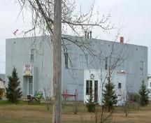 View of the Grounds of  Wakaw Elementary School featuring the Law Office Building and the 1949 School.; Winkel, 2007.