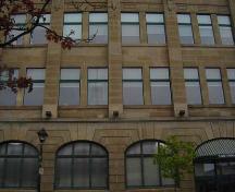 Of note is the classical symmetry and arched first-storey windows.; Kendra Green, 2007.