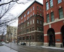Contextual view (with original three storey section distinguished from recent two storey addition by brick colour and fenestration), from the southwest, of the Northern Electric Building, Winnipeg, 2007; Historic Resources Branch, Manitoba Culture, Heritage and Tourism, 2007