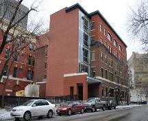Secondary elevations (with original three storey section distinguished from recent two storey addition by brick colour and fenestration and also showing lobby addition), from the northeast, of the Northern Electric Building, Winnipeg, 2007; Historic Resources Branch, Manitoba Culture, Heritage and Tourism, 2007