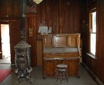 Stove and organ, 2004.; Government of Saskatchewan, Lisa Dale-Burnett, 2004.