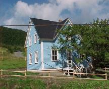 View of main facade and right gable end of Hezikiah House in Woody Point, NL.; Heritage Foundation of Newfoundland and Labrador, 2005.