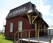 Primary elevations, from the northeast, of the La Rivière Canadian Pacific Railway Stations, La Rivière area, 2006; Historic Resources Branch, Manitoba Culture, Heritage, Tourism and Sport, 2006