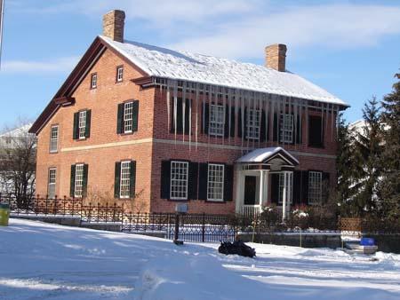 Facade and West Elevation and of 438 Malabar Drive