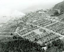 View of the Powell River Historic District, showing the compact placement of housing on the plan, and their spatial relationship to each other, 1956.; PRA, neg. 14110, May 1956
