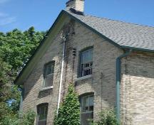 Of note are the 2 over 2 windows and chimney on the west elevation.; Kendra Green, 2007.