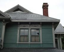 Of note is the horizontal and diagonal wood siding and the slate roof.; Martina Braunstein, 2007.