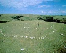 View of kidney-shaped fieldstone ceremonial feature, 1973.; Government of Saskatchewan, 1973.