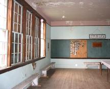 Interior of Crystal Hill School showing large bank of windows on the west side of the school.; Government of Saskatchewan, Lisa Dale-Burnett, 2004.
