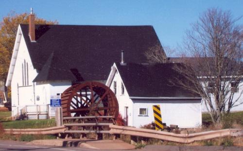 Showing context of building next to church