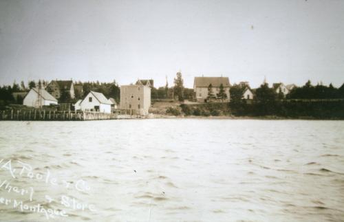 Poole House on left above wharves and stores