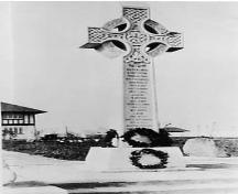View of the Richmond Cenotaph with wreath showing part of Municipal Hall behind, c.1945; Richmond Archives No. 1977 218