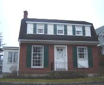Featured is the symmetrical elevation with large front windows, 2007.; Lindsay Benjamin, 2007